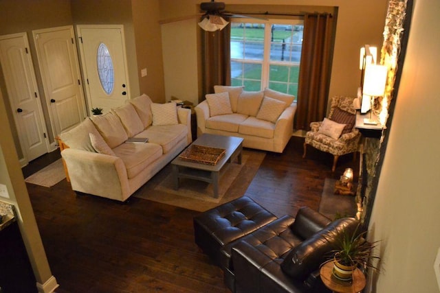 living room with dark wood-type flooring and ceiling fan