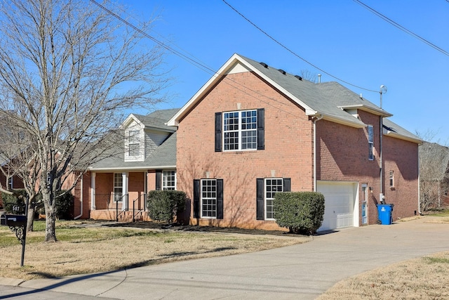 exterior space with a front yard, a porch, and a garage