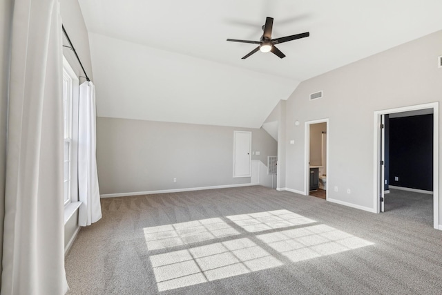 unfurnished living room with ceiling fan, light carpet, and lofted ceiling