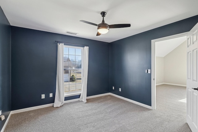 empty room featuring carpet floors and ceiling fan