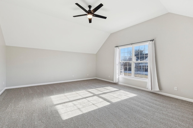 additional living space with vaulted ceiling, ceiling fan, and carpet