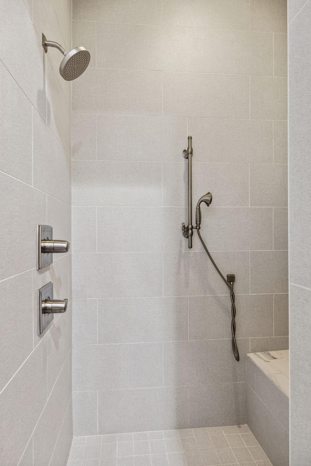 bathroom with a tile shower