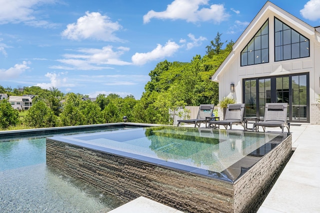 view of swimming pool featuring a patio area