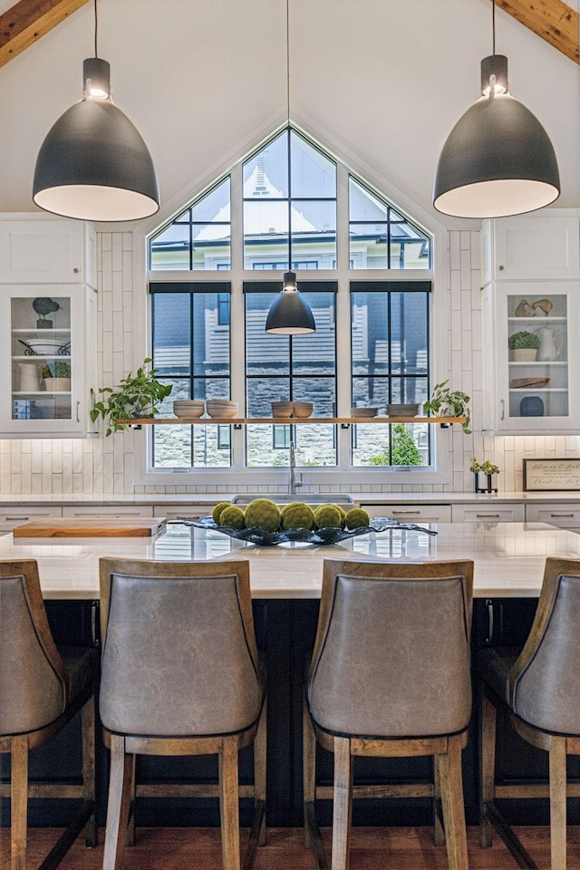 interior space with lofted ceiling with beams