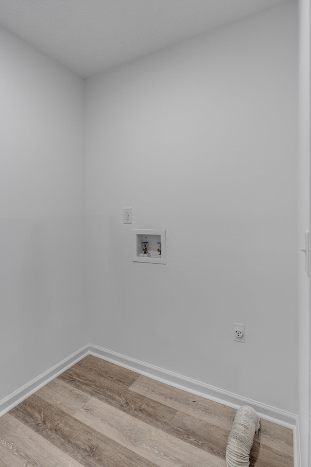 laundry room with washer hookup, hookup for an electric dryer, and hardwood / wood-style floors