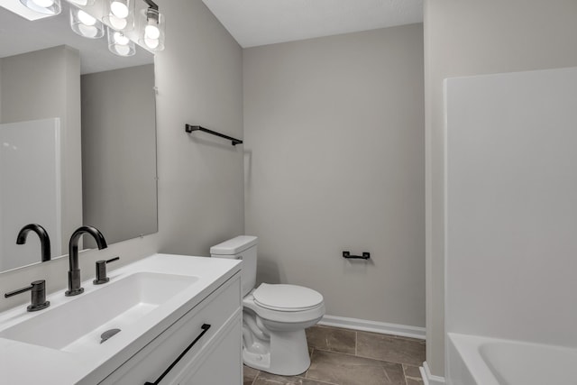 bathroom with toilet and vanity