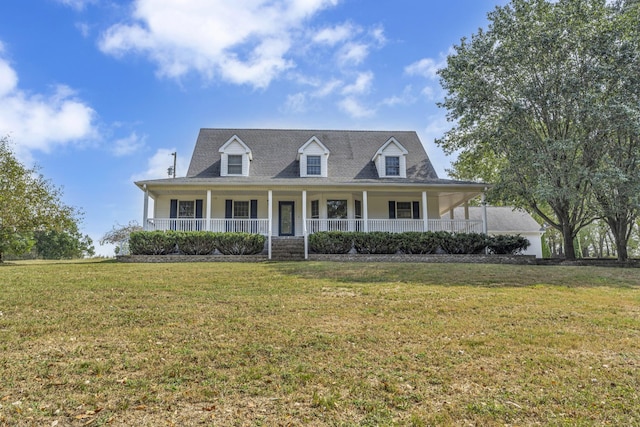 view of front of house with covered porch and a front yard