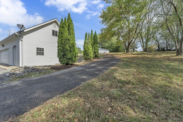 view of home's exterior with a yard