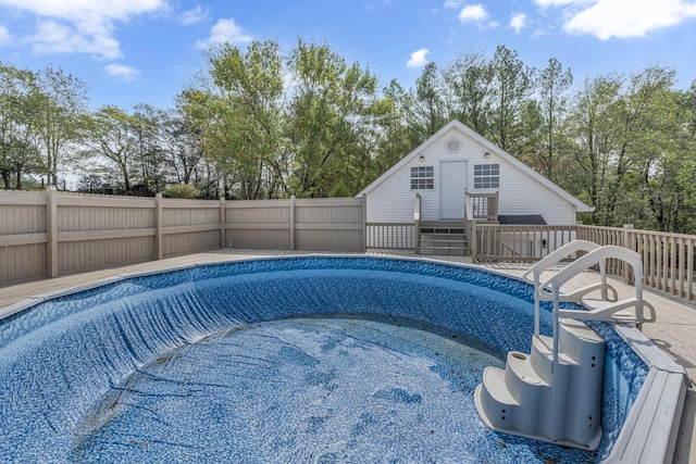 view of swimming pool featuring an outdoor structure