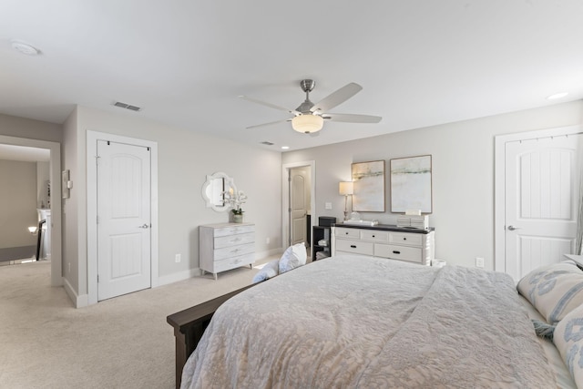 carpeted bedroom with ceiling fan