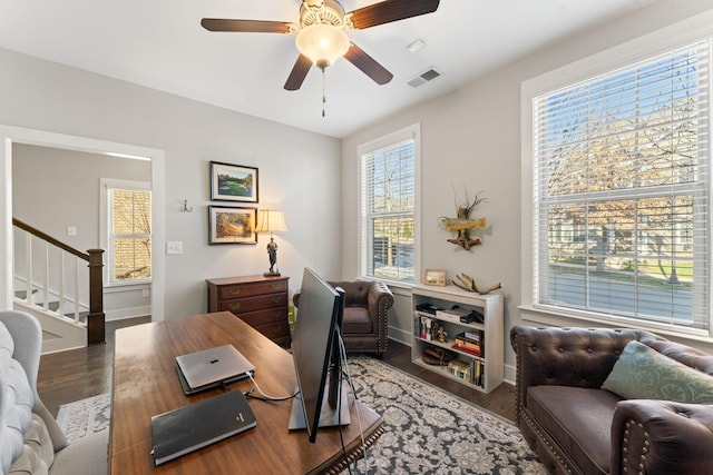 home office with ceiling fan and hardwood / wood-style floors