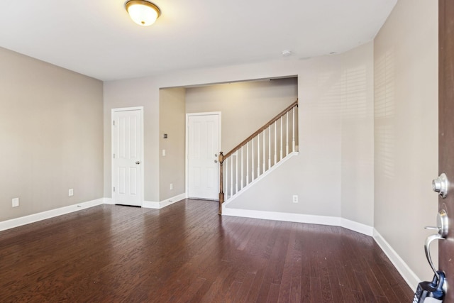 unfurnished room featuring dark hardwood / wood-style flooring