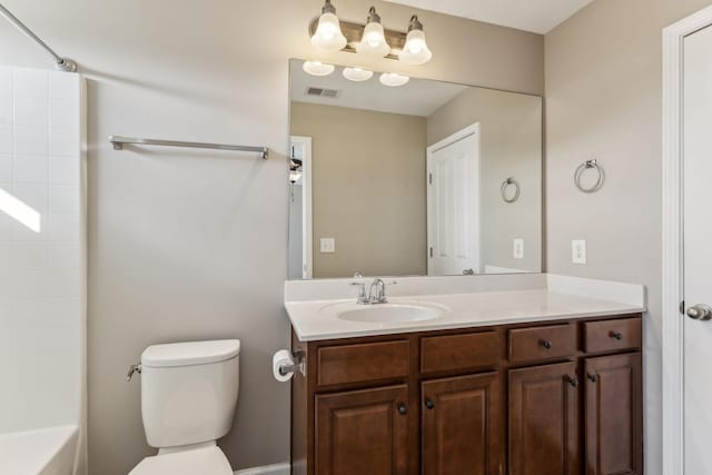 full bathroom featuring toilet, vanity, and tub / shower combination