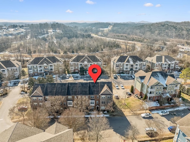 birds eye view of property with a mountain view