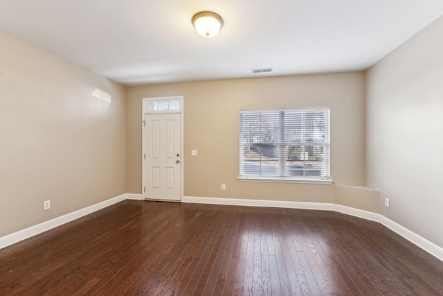 foyer entrance featuring dark hardwood / wood-style floors