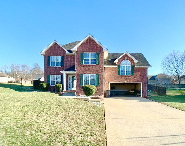 view of front of property featuring a garage and a front lawn