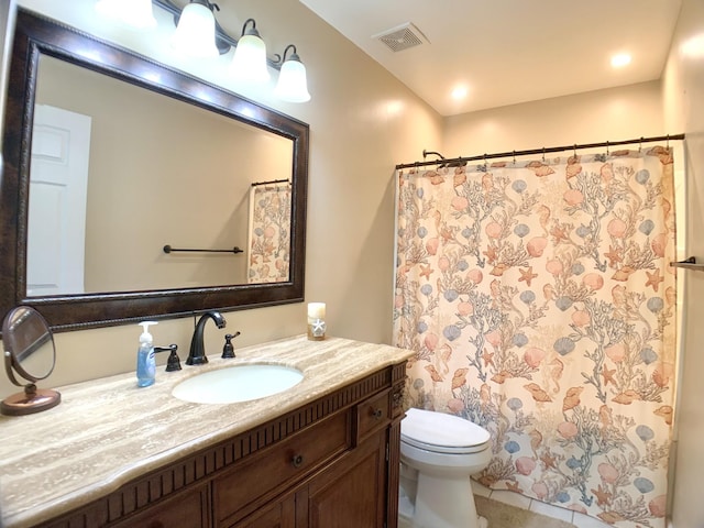 bathroom with toilet, vanity, tile patterned floors, and a shower with shower curtain