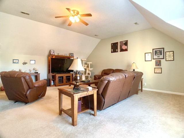 living room with ceiling fan, carpet, and vaulted ceiling