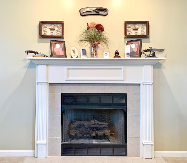 details featuring a tile fireplace