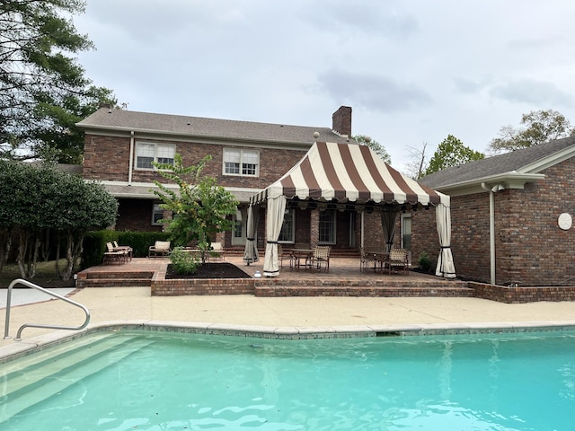 back of house featuring a patio