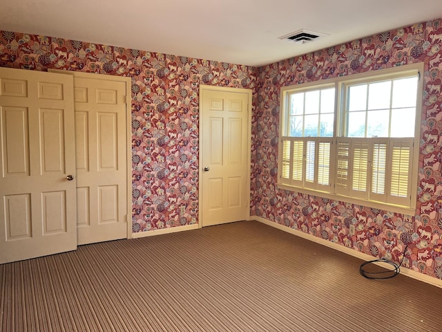 spare room featuring carpet floors