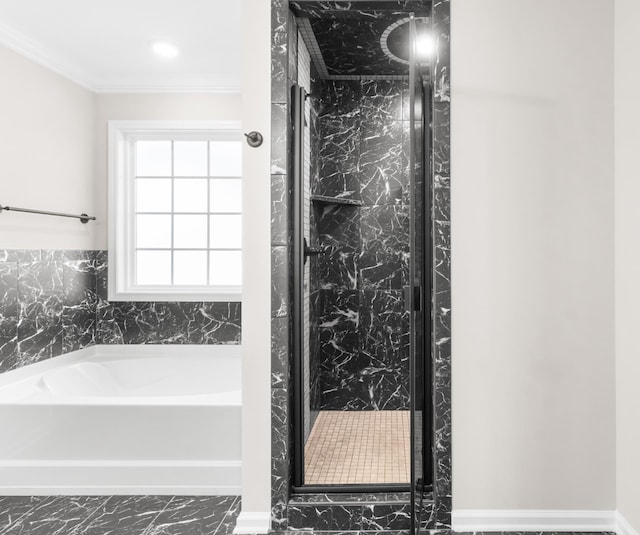 bathroom featuring a bathing tub and crown molding