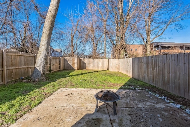 view of yard with a patio area and a fire pit