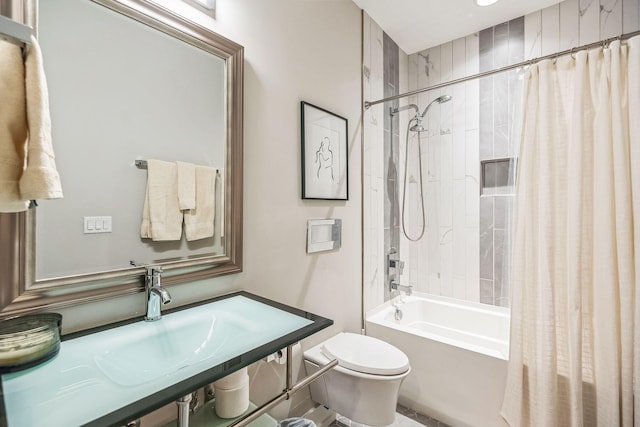 full bathroom featuring toilet, sink, and shower / bath combo with shower curtain