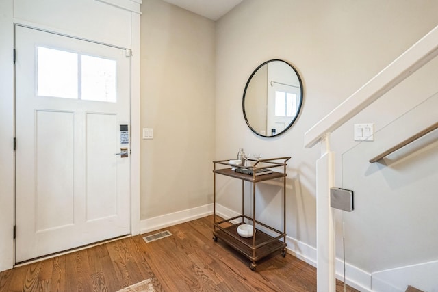 entryway with hardwood / wood-style flooring