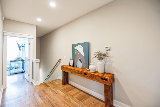 hall with light hardwood / wood-style floors