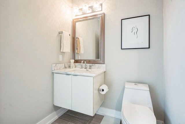 bathroom with toilet and vanity