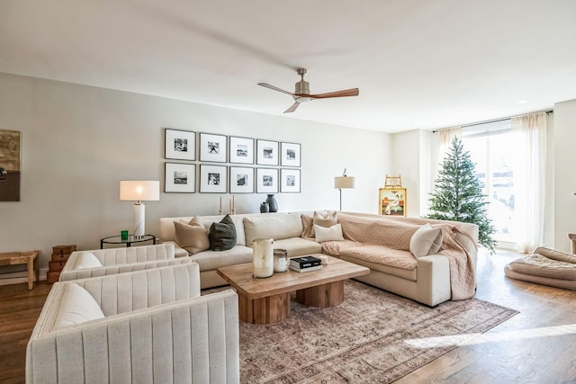 living room with ceiling fan and wood-type flooring