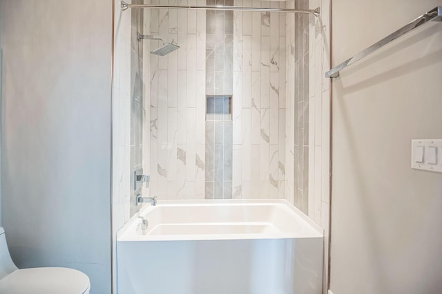 bathroom featuring toilet and bathtub / shower combination