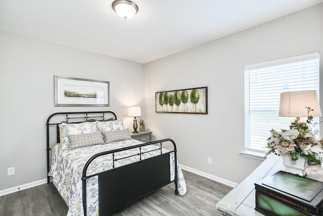 bedroom with wood-type flooring