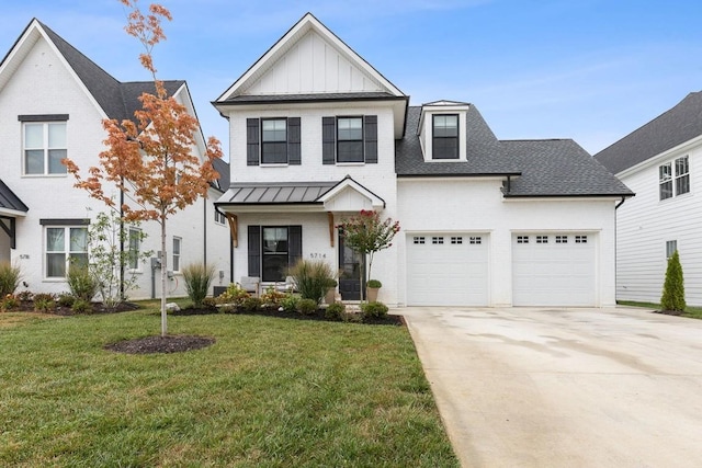 view of front of house featuring a front lawn, a garage, and a porch