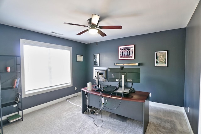 home office with ceiling fan and carpet flooring