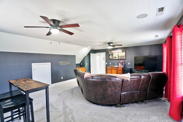 carpeted living room with vaulted ceiling and ceiling fan