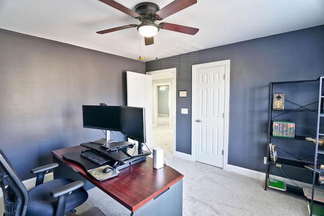 office area with ceiling fan and carpet