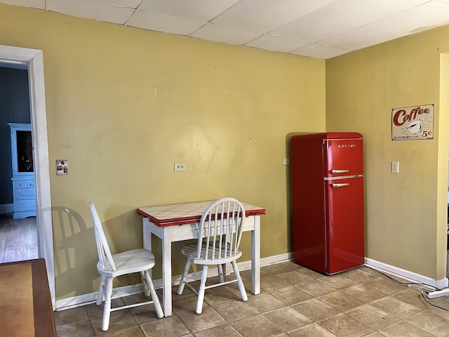 dining space featuring a paneled ceiling