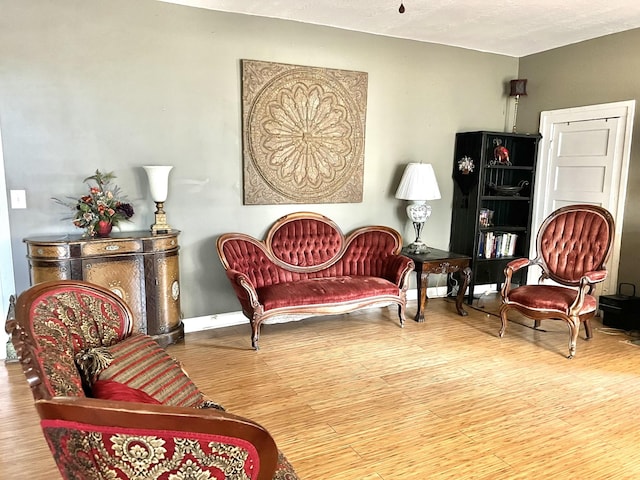 sitting room featuring hardwood / wood-style flooring