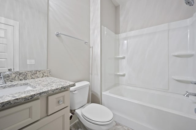 full bathroom featuring toilet, vanity, and bathtub / shower combination