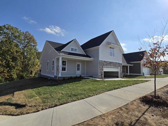 view of front of home featuring a front lawn and a garage