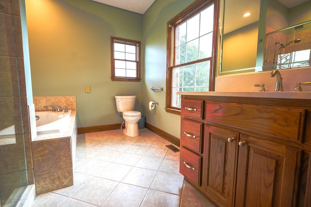 full bathroom featuring independent shower and bath, tile patterned floors, vanity, and toilet