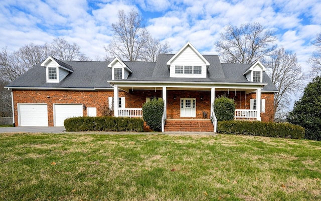 cape cod home featuring covered porch, a front lawn, and a garage