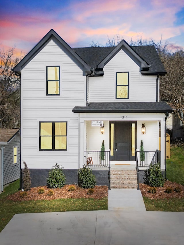 view of front of property featuring covered porch