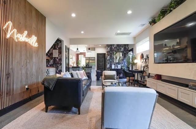 living room featuring wood walls