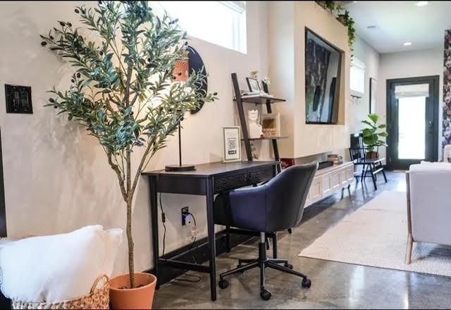 office featuring concrete floors and plenty of natural light