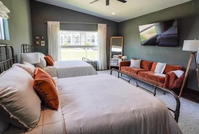 bedroom with ceiling fan and lofted ceiling