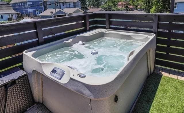 deck featuring a hot tub