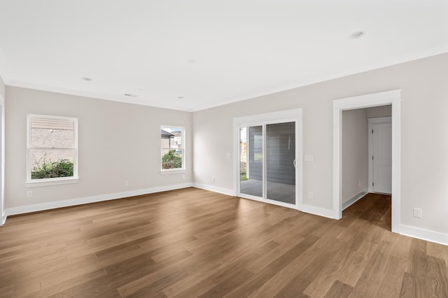 unfurnished room featuring hardwood / wood-style floors